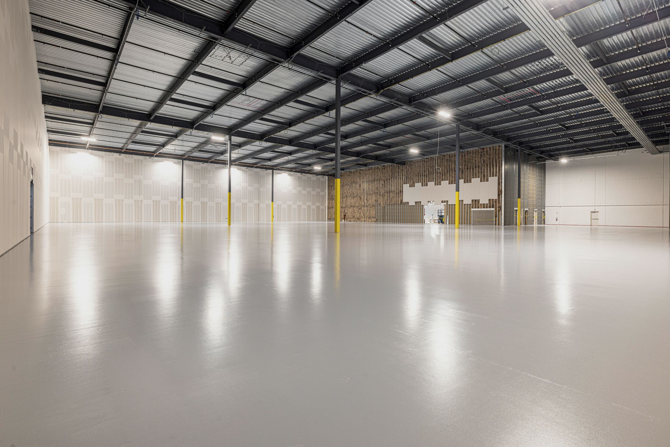 Warehouse interior with dock doors and a sealed floor