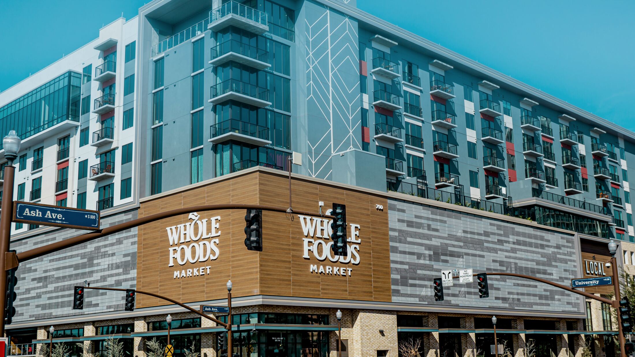 Mixed-use retail and residential building at a street corner
