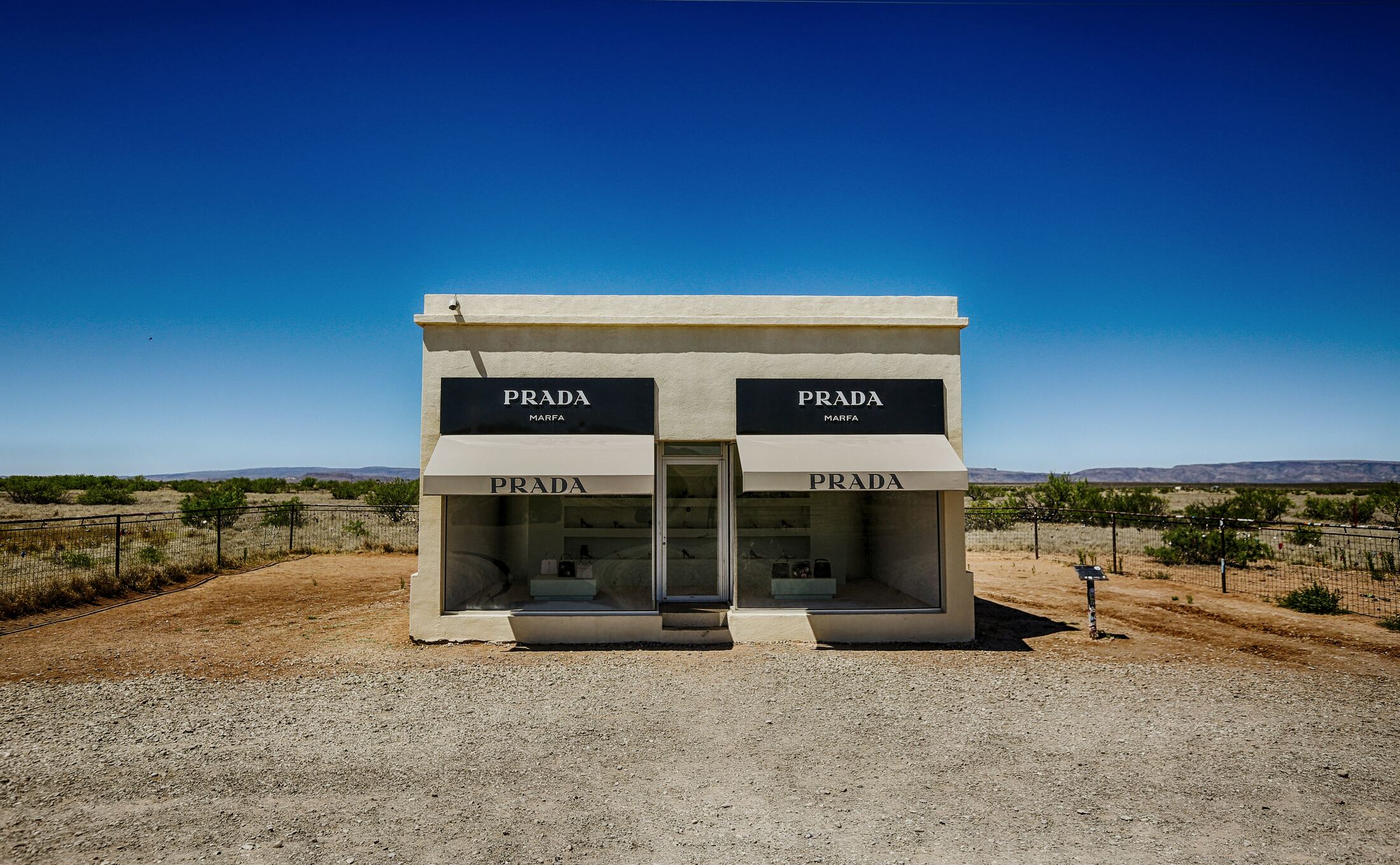 Small standalone building on an open desert site